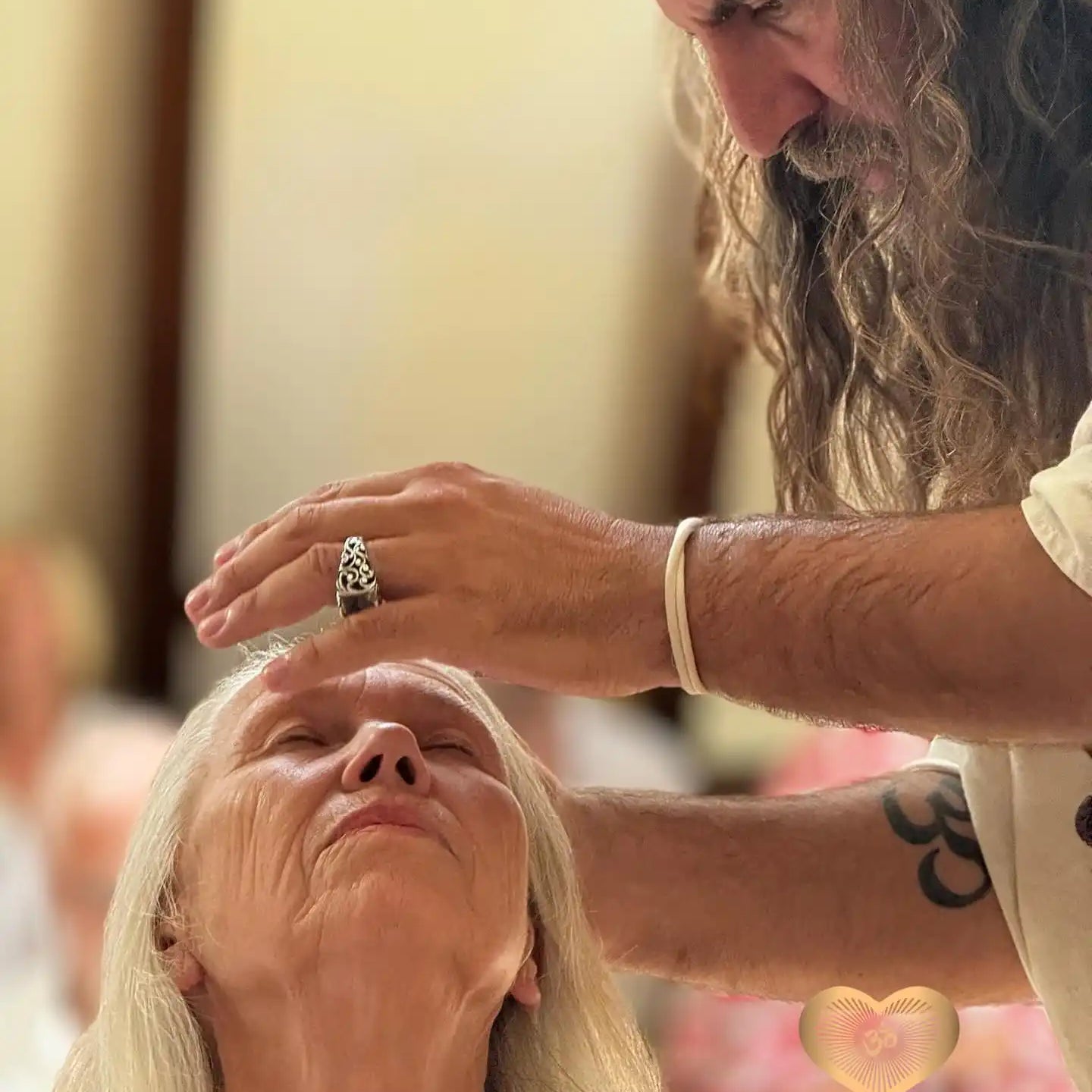 A healing or energy work session with someone receiving treatment while lying down.