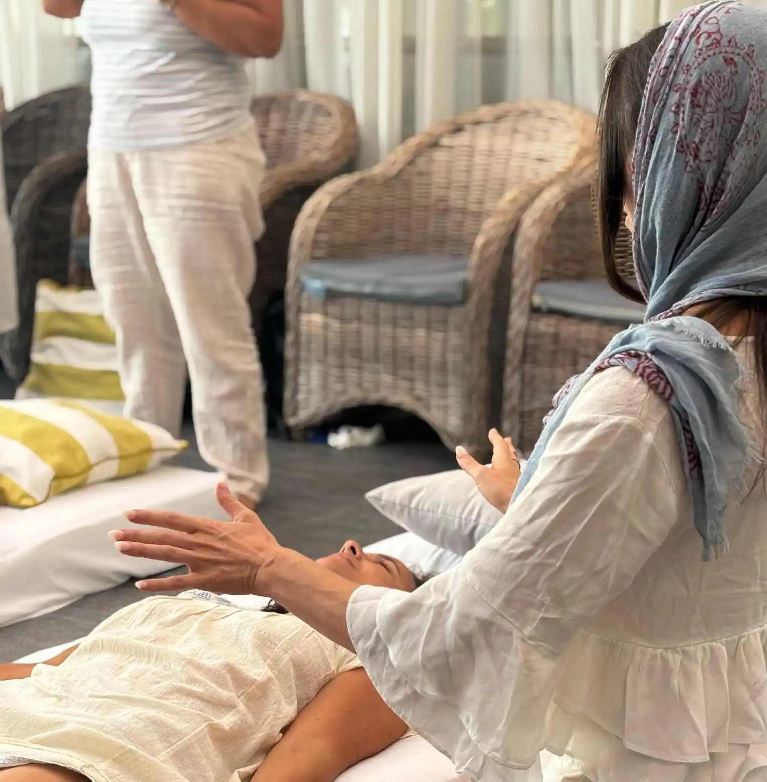 A person receiving a healing or energy therapy session.