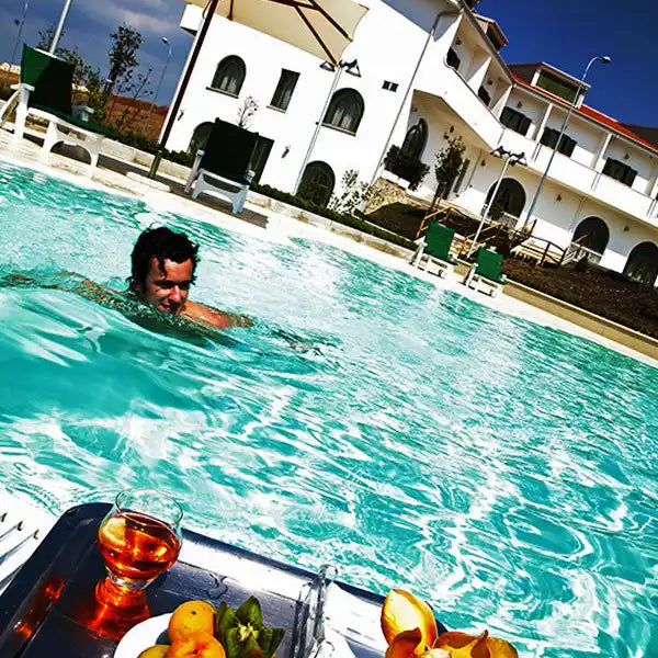 Refreshing poolside fruit and drink.