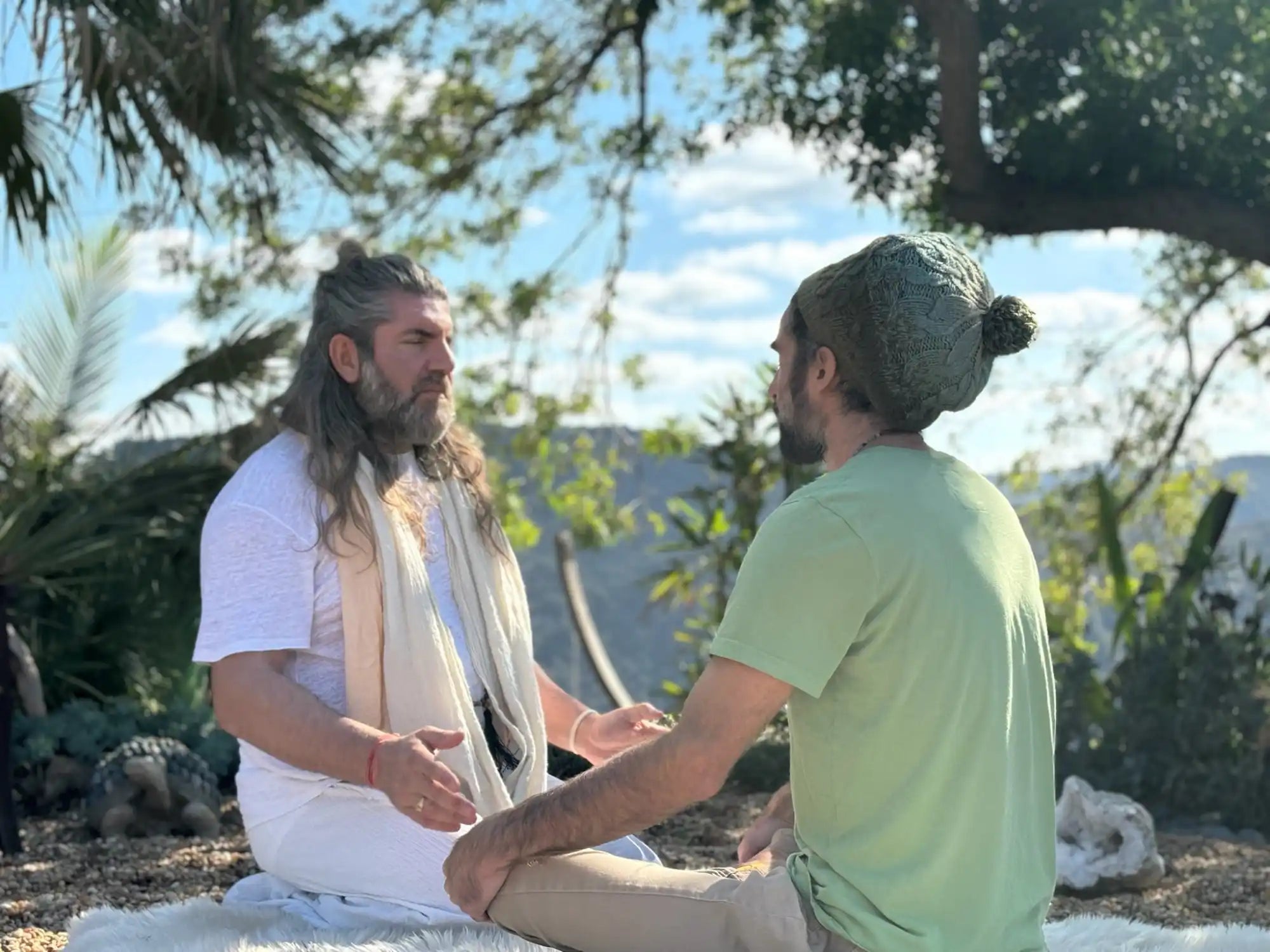 Two men meditating outdoors.