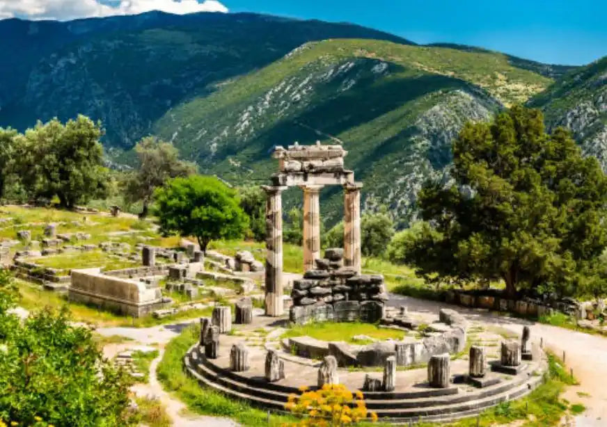 Ancient Greek ruins of a circular temple with columns.