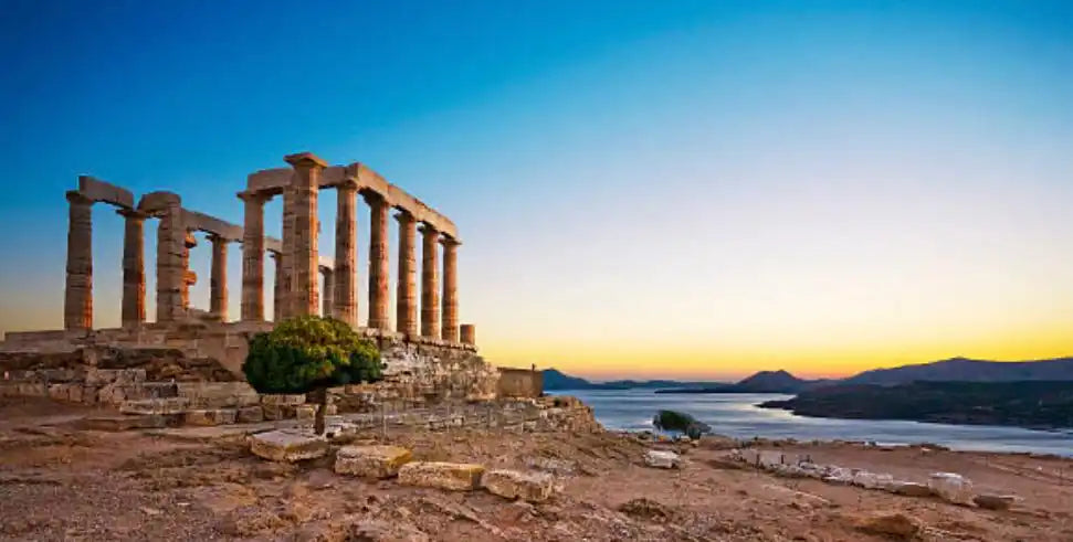 Ancient stone temple ruins with towering columns.