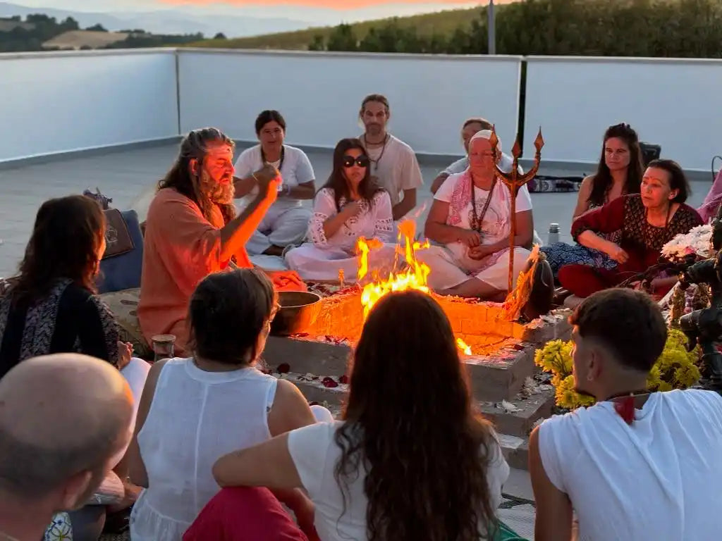 A group of people gathered around a fire pit.