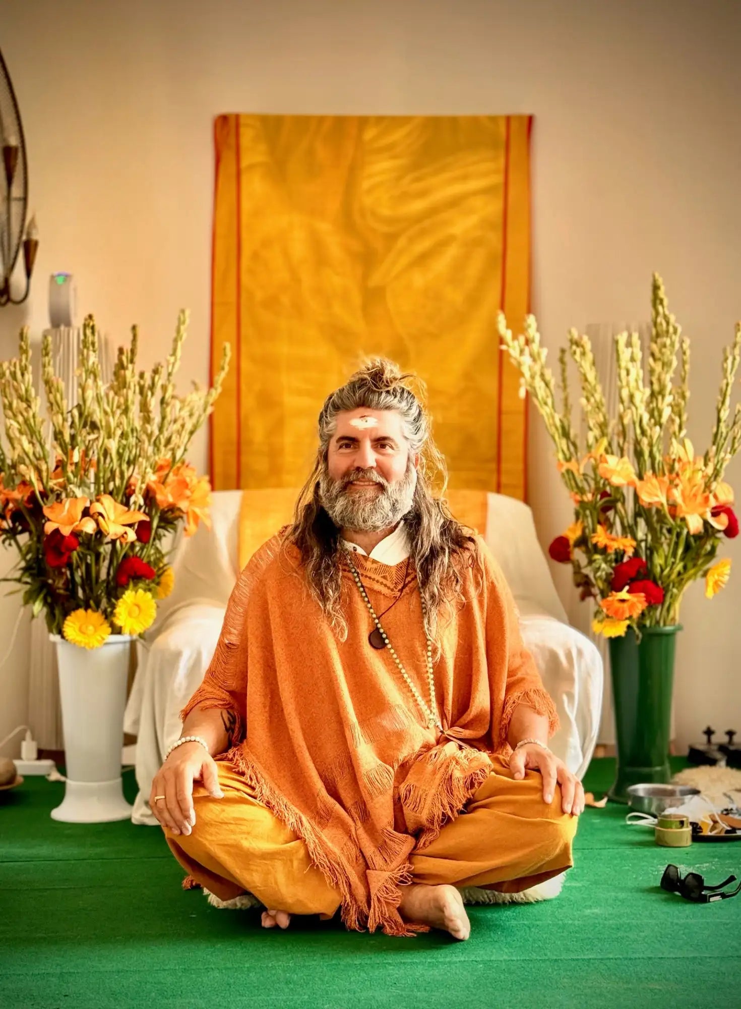 Orange and white lotus pose meditation cushion with floral accents.