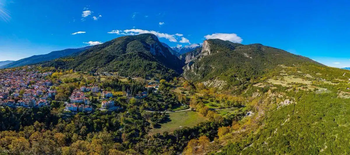 A panoramic view of a mountain village and gorge.