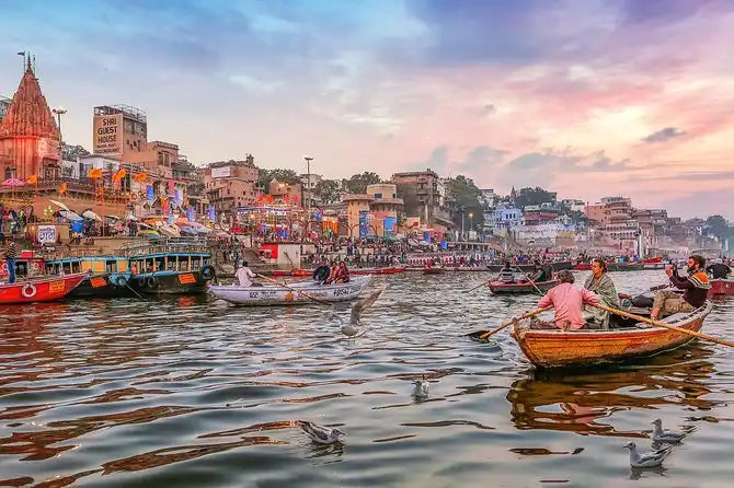 A vibrant riverside city with bustling boats and a temple.
