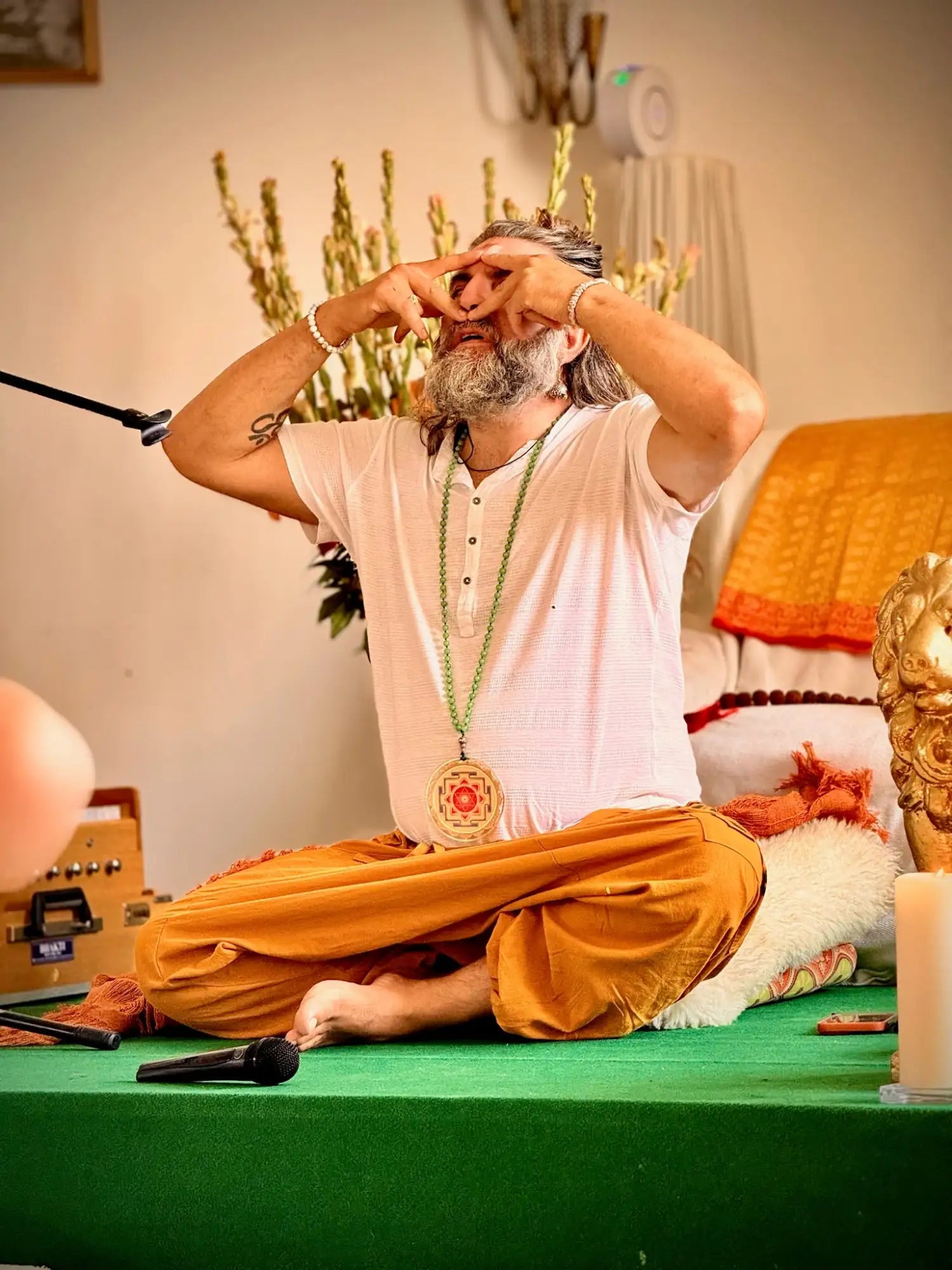 White and orange dhoti with intricate patterns, likely cotton or linen material.